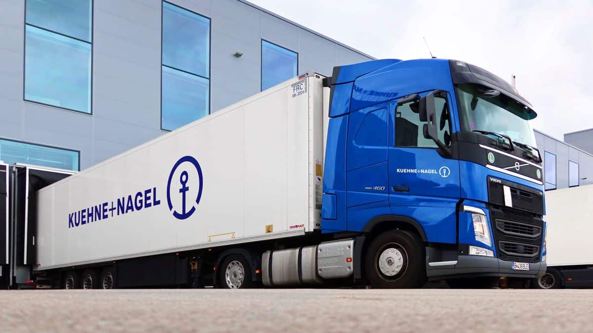 Kuehne+Nagel truck in front of a warehouse